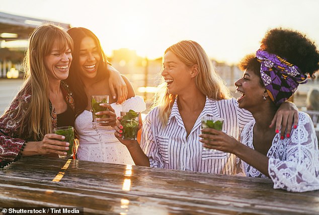 99087049-14780157-A_young_group_of_friends_pictured_enjoying_a_beverage_stock_imag-a-1_1749221050645.jpeg